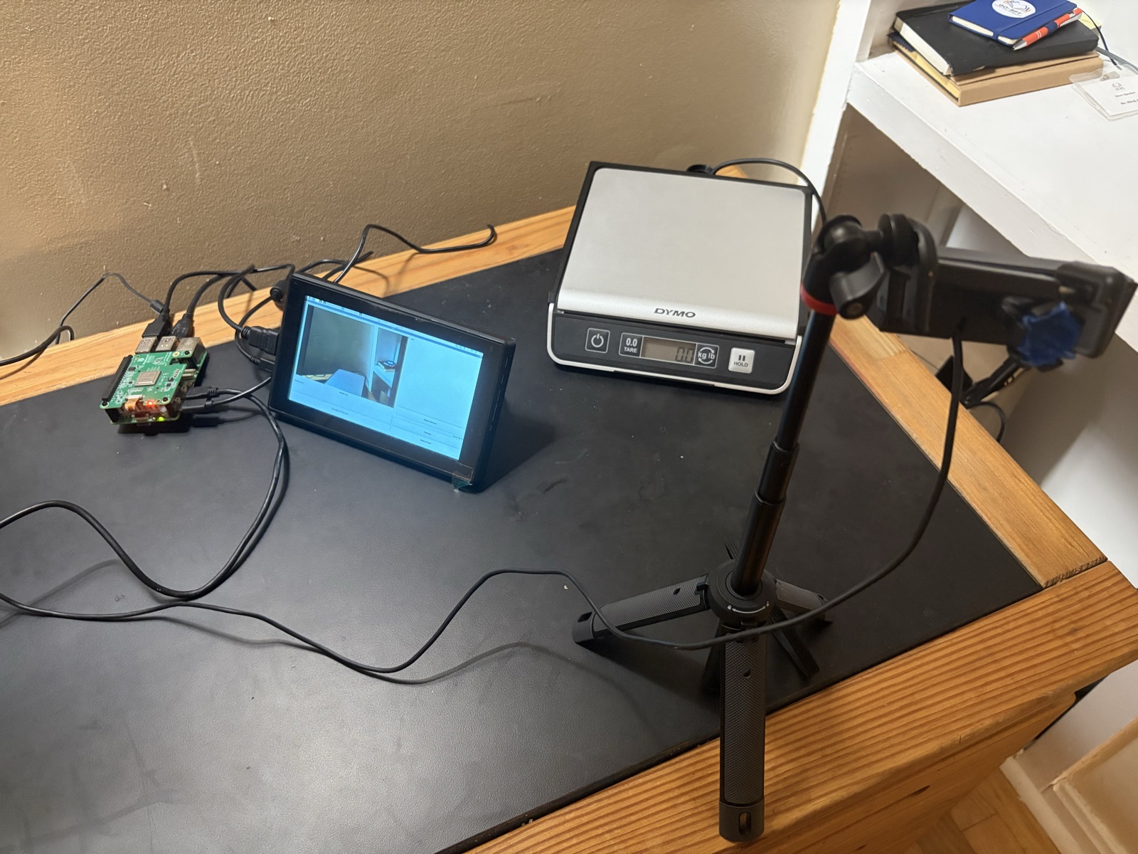 Salis bench prototype: Raspberry Pi, Dymo scale, camera, and the kiosk UI mid-session